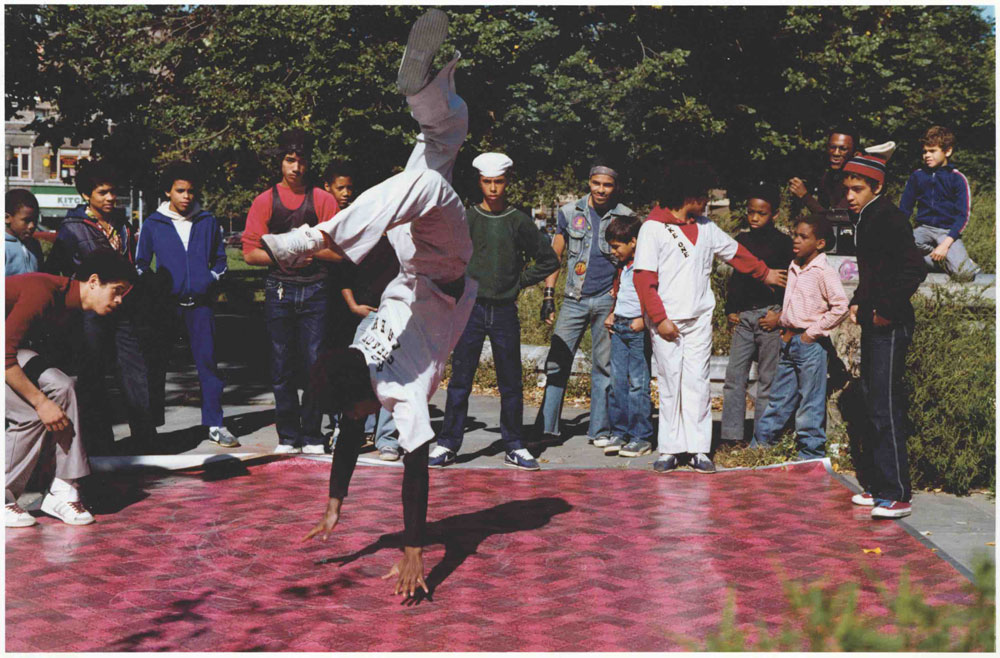 The Rock Steady Crew rolled out the red vinyl mat in the South Bronx Crotona Parks scene and busted moves for the camera, like Frosty Freeze’a classic, “Suicide,” 1981. Photo © Cathy Campbell.