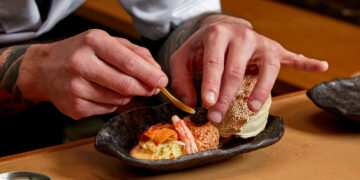 Chef Kevin plating the Kegani, hairy horse crab from Hokkaido